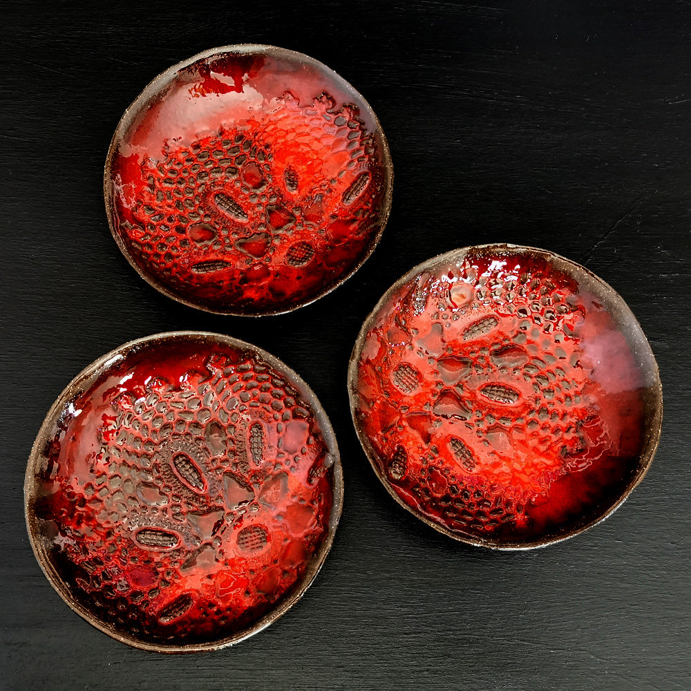 3 Small Red Plates With Crochet Pattern